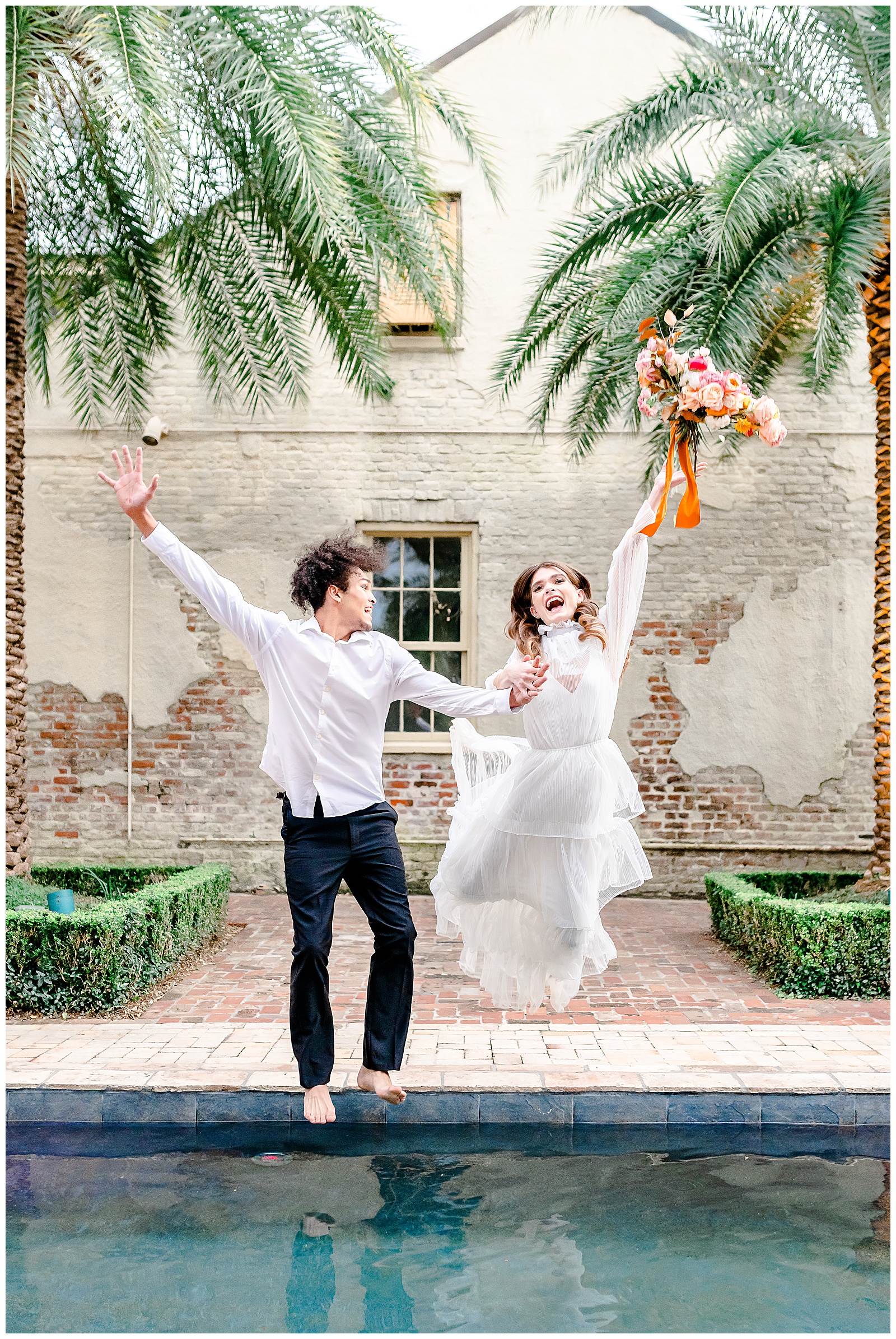 New Orleans Wedding Race + Religous Wedding Couple bride jumping in pool in wedding dress